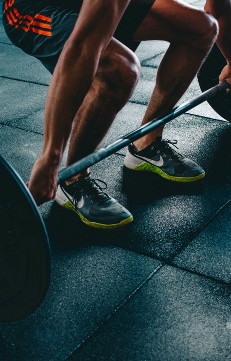 man performing a deadlift